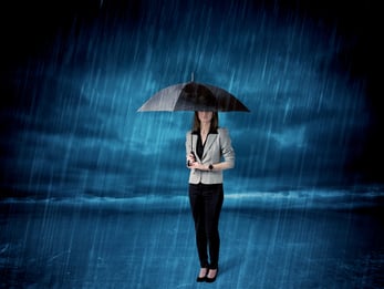 Business woman standing in rain with an umbrella concept on background