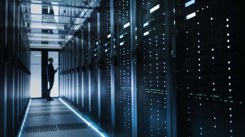 MSP Managed Service Provider Confused Businessman standing in dark hallway