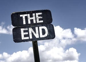 The End sign with clouds and sky background