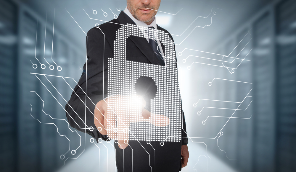Businessman selecting a futuristic padlock with a data center on the background-3