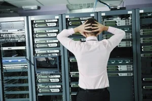 it business man in network server room have problems and looking for  disaster situation  solution-2-1